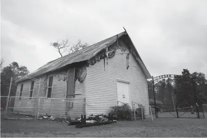  ?? Staff photo by Evan Lewis ?? n Cedar Grove Church in Genoa, Ark., was damaged Friday afternoon by a fire.