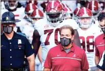  ?? AP - L.G. Patterson, file ?? Though he has not shown any symptoms of the coronaviru­s, Nick Saban will not be allowed to coach when Alabama faces Georgia in Saturday’s SEC showdown.