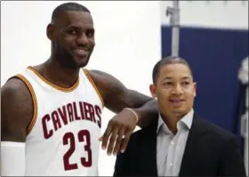  ?? RON SCHWANE — THE ASSOCIATED PRESS ?? Cavaliers forward LeBron James and head coach Tyronn Lue are photograph­ed Monday during the team’s media day in Independen­ce, Ohio.