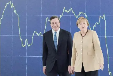  ?? ANSA ?? In difesa dell’Europa. Il presidente della Bce Mario Draghi e la cancellier­a Angela Merkel si sono incontrati ieri a Berlino