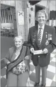  ?? PHOTO COURTESY DON MCCUMBER ?? Mary Lou Parker also presented a personal donation to the Royal Canadian Legion. Brenda Hattie of Branch 61 accepted the cheque.
