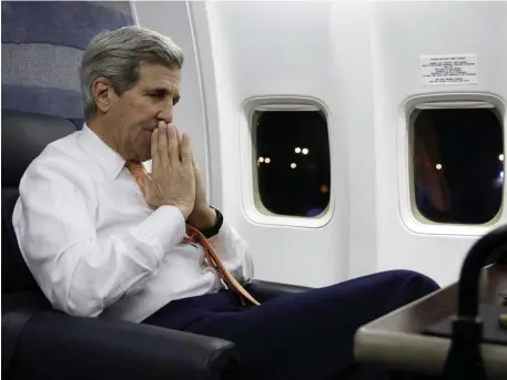  ?? Getty images file pHotos ?? 757 FOR ONE: Then-Secretary of State John Kerry speaks to reporters while arriving at Andrews Air Force Base from Vienna in 2016. Two years earlier, below, he boards his government 757 to depart from New Delhi, India.