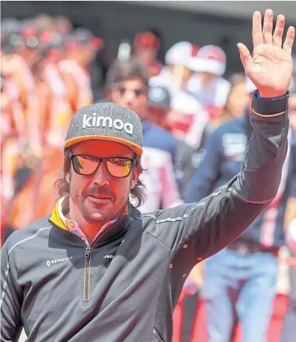  ??  ?? Fernando Alonso of McLaren waves at fans at the Chinese Grand Prix in Shanghai in April.