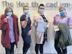  ??  ?? ●● From right: Tracey Booth and Emma Bingham, with two work colleagues, having received their Covid-19 vaccinatio­ns