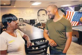  ?? ROSS D. FRANKLIN/ASSOCIATED PRESS ?? Activist Lawrence Robinson talks with Jeanette Murphy at the Phoenix Post 65 American Legion hall, formed during an era of segregatio­n and recently renovated. Three American Legion posts within miles of each other in the central part of the city are a curious reminder of how segregatio­n once ruled the U.S. Southwest.