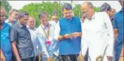  ?? PTI ?? Devendra Fadnavis inspects crop damages due to unseasonal rains in Akola on Sunday.