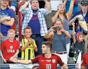  ?? File, David Zalubowski / AP ?? Fans celebrate behind U.S. midfielder Christian Pulisic after he scored his second goal against Trinidad &amp; Tobago.