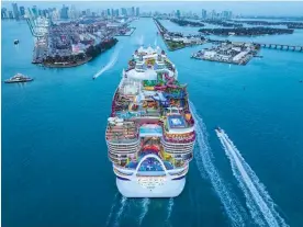  ?? ?? The world’s largest cruise ship, Royal Caribbean’s Icon of the Seas, which will leave Miami tomorrow on its maiden voyage. Friends of the Earth US said: ‘By building these megaships and using LNG, the cruise industry is moving in the wrong direction.’