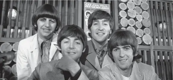  ?? BORIS SPREMO/THE CANADIAN PRESS FILE PHOTO ?? The Beatles, from left, Ringo Starr, Paul McCartney, John Lennon and George Harrison, pose at Maple Leaf Gardens before their 1964 concert.