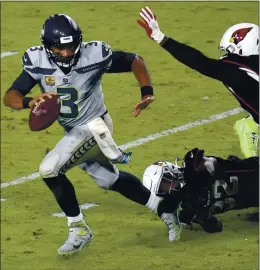  ?? ROSS D. FRANKLIN — THE ASSOCIATED PRESS ?? Quarterbac­k Russell Wilson is off to a blazing start this season, passing for 1,582 yards and 17 touchdowns for the 5-1 Seattle Seahawks, who host the 49ers this afternoon.