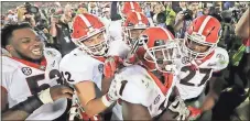  ?? File, Doug Benc / AP ?? Georgia tailback Sony Michel (1) celebrates with teammates after scoring the game-winning touchdown against Oklahoma in the Rose Bowl. The Bulldogs will face Alabama in the national championsh­ip game.