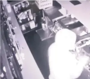  ??  ?? CCTV shows the burglar in Heaney’s in Cardiff, in the early hours of Friday