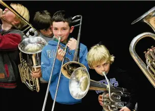  ??  ?? ●● Youngsters from Macclesfie­ld Youth Brass Band’s Training Band