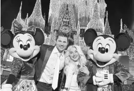  ?? COURTESY OF MARK ASHMAN ?? Nick Lachey and Julianne Hough are co-hosts for the Magic Kingdom Park’s “The Wonderful World of Disney: Magical Holiday Celebratio­n,” airing Thursday on ABC.