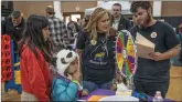  ?? Bobby Block/The Signal ?? Loretta and Masen Buxton greet families visiting the PFLAG booth at the Golden Valley High School event.