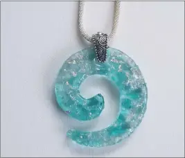  ?? ?? “Glass Journey Circle,” a glass pendant by Riverside artist Samshine.