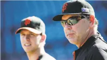  ?? Marcio Jose Sanchez / Associated Press 2014 ?? Giants manager Bruce Bochy (right), with Buster Posey, can expect acknowledg­ments in each city the Giants visit in 2019.