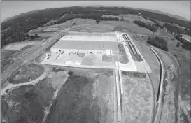  ??  ?? Above: This is an aerial view of the Audia Plastics plant north of LaFayette on U.S. Highway 27. (Contribute­d photos) Right: Pallets of plastic pellets being readied for shipment . (Catoosa News photo/Mike O’Neal)