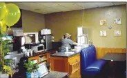  ?? ( NWA Democrat-Gazette/Mike Eckels) ?? Mandy Hobbs works to fill a take-out order in the Gallery’s service area. The popular home cooking restaurant opened its doors in downtown Decatur Sept. 8 after the covid-19 outbreak closed all restaurant­s in March.