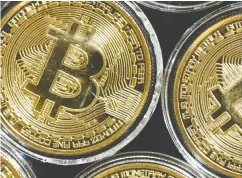  ?? OZAN KOSE/ AFP VIA GETTY IMAGES ?? Bitcoin, which has marginal intrinsic value, relies on the
faith of its holders that it is worth more than nothing.