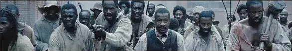 ??  ?? Le réalisateu­r Nate Parker (au centre) interprète Nat Turner, un esclave noir américain qui organisa une révolte contre ses maîtres blancs.