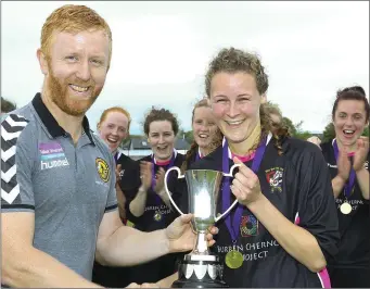  ??  ?? Méabh Kehoe, captain of Seaview United, receives the cup from Barry Dempsey.