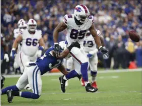  ?? JOHN MINCHILLO - THE ASSOCIATED PRESS ?? Buffalo Bills tight end Charles Clay (85) fumbles as he is hit by Indianapol­is Colts defensive back Mike Mitchell (34) during the first half of an NFL football game in Indianapol­is, Sunday, Oct. 21, 2018.