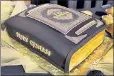  ??  ?? GOOD BOOK: A specialty prom cake was fashioned to look like the Quran.