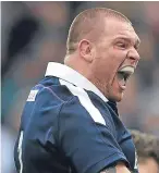  ??  ?? Gordon Reid celebrates his try against England on Saturday.