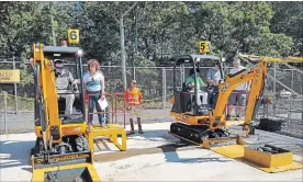  ?? DIGGERLAND PHOTO ?? People operate equipment at the Diggerland amusement park in New Jersey. Diggerland is partnering with Bingemans to open an Excavation Station at the Kitchener recreation complex.