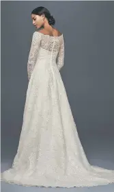  ??  ?? BACK DETAIL The best way to add excitement to a gown this year is on the back. Extra details such as a lace appliqué or delicate buttons as seen on this off-the-shoulder A-line wedding dress by Oleg Cassini, ensures a bride makes a statement heading...