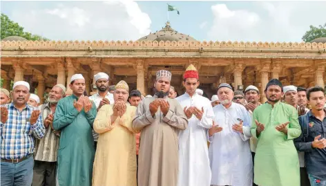  ?? — AFP ?? Faithful participat­e in a special prayer asking to maintain peace and harmony ahead of the court verdict of disputed religious site of Ayodhya, in the campus of ancient holy shrine of Hazrat Saiyed Usman Shamme Burhani in Ahmedabad.