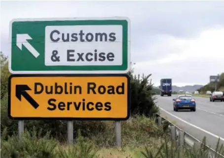  ?? AFP ?? Signs point to an old customs and excise area on the Dublin road in Newry, Northern Ireland, on the border between Northern Ireland and the Irish Republic.