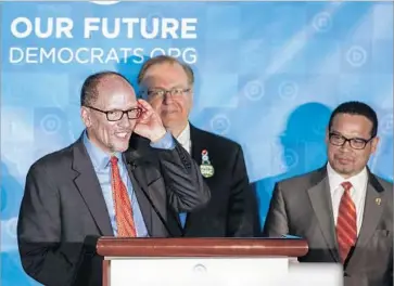  ?? Erik S. Lesser European Pressphoto Agency ?? NEW DNC CHAIRMAN Tom Perez, left, and deputy chair and rival for the post, Rep. Keith Ellison of Minnesota, right. “We don’t have the luxury of going out of this room divided,” Ellison told his unhappy supporters.