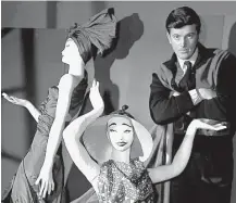  ?? Associated Press file ?? French fashion designer Hubert de Givenchy is shown posing with mannequins in his shop in Paris early in his career. The pioneer of ready-to-wear style died Saturday.