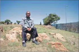  ??  ?? Gone: Amos Skhosana can’t find his grandparen­ts’s graves on the land that’s now occupied by Endulwini Primary School. Photos: Oupa Nkosi
