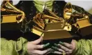  ?? Photograph: Chris Pizzello/Invision ?? Billie Eilish holding her Grammy awards at the 2020 ceremony.