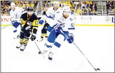  ?? (AFP) ?? Braydon Coburn #55 of the Tampa Bay Lightning skates with the puck against Nick Bonino #13 of the Pittsburgh Penguins in Game Five of the Eastern Conference Final during the 2016 NHL Stanley Cup Playoffs at Consol Energy Center
on May 22, in...