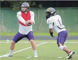  ?? PETER LEE WATERLOO REGION RECORD ?? QB Tristan Arndt, left, running back Levondre Gordon and their Laurier teammates are preparing to face McMaster, whose defence is ranked second in the OUA.