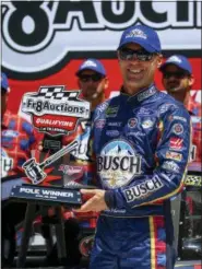  ?? BUTCH DILL — THE ASSOCIATED PRESS ?? NASCAR driver Kevin Harvick (4) wins the pole for the GEICO 500 auto race at Talladega Superspeed­way, Saturday in Talladega, Ala.