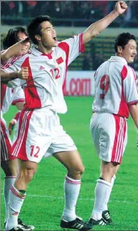  ?? PROVIDED TO CHINA DAILY ?? Team China players celebrate beating Qatar 3-0 during their last home game of the 2002 World Cup Asian Zone qualifiers at Wulihe Stadium in Shenyang, Liaoning province. China’s qualificat­ion for the 2002 Korea-Japan World Cup was its only World Cup...