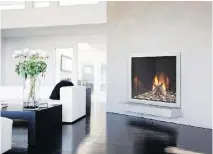  ??  ?? A gas fireplace, like this Lux series model by Heat & Glo, can add warmth and ambience to even the most minimalist, contempora­ry interior.