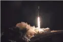  ?? KEEGAN BARBER/NASA VIA AP ?? A SpaceX rocket carrying the SWOT satellite lifts off Friday from Vandenberg Space Force Base in California.