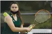  ??  ?? Vanden High’s Delaney Ramsell smashes a backhand return during the second set of her 6-0, 6-1 victory over Vacaville High’s Julia Persinger in their number three singles match Wednesday.