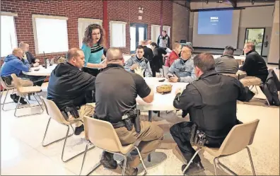  ?? [ANTONIO PEREZ/CHICAGO TRIBUNE] ?? Police officers from Chicago’s western suburbs attend a presentati­on on suicide by Carrie Steiner, a licensed clinical/police psychologi­st.