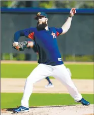  ?? AP/JEFF ROBERSON ?? Houston Astros pitcher Dallas Keuchel takes part in a drill during spring training in West Palm Beach, Fla. Even though he has won a Cy Young and a World Series title, Keuchel is interested in finding ways to improve.