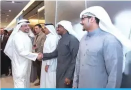  ??  ?? Omar Alghanim greets employees.