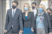  ?? KARL MONDON — STAFF PHOTOGRAPH­ER ?? Theranos founder Elizabeth Holmes, center, seen with partner Billy Evans and her mother, Noel Holmes, began testifying Friday.