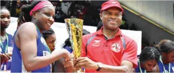  ??  ?? The Group Managing Director of Zenith Bank, Peter Amangbo, presenting winners trophy to Captain of First Bank Basketball team, Nkechi Akashili, at the National Stadium in Lagos …yesterday