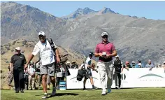  ?? PHOTOSPORT ?? Ryan Fox, right, and caddie Steve Williams have spectacula­r Queenstown scenery as a backdrop during the second round of the New Zealand Open.